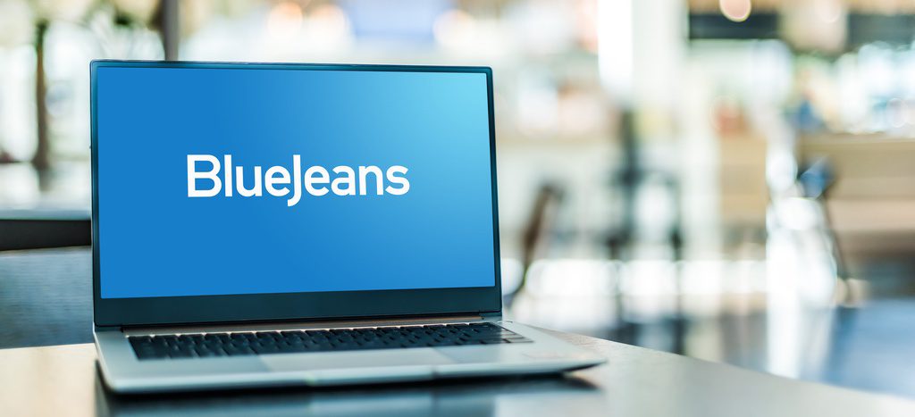 Laptop computer displaying logo of BlueJeans by Verizon, a company that provides an interoperable cloud-based video conferencing service