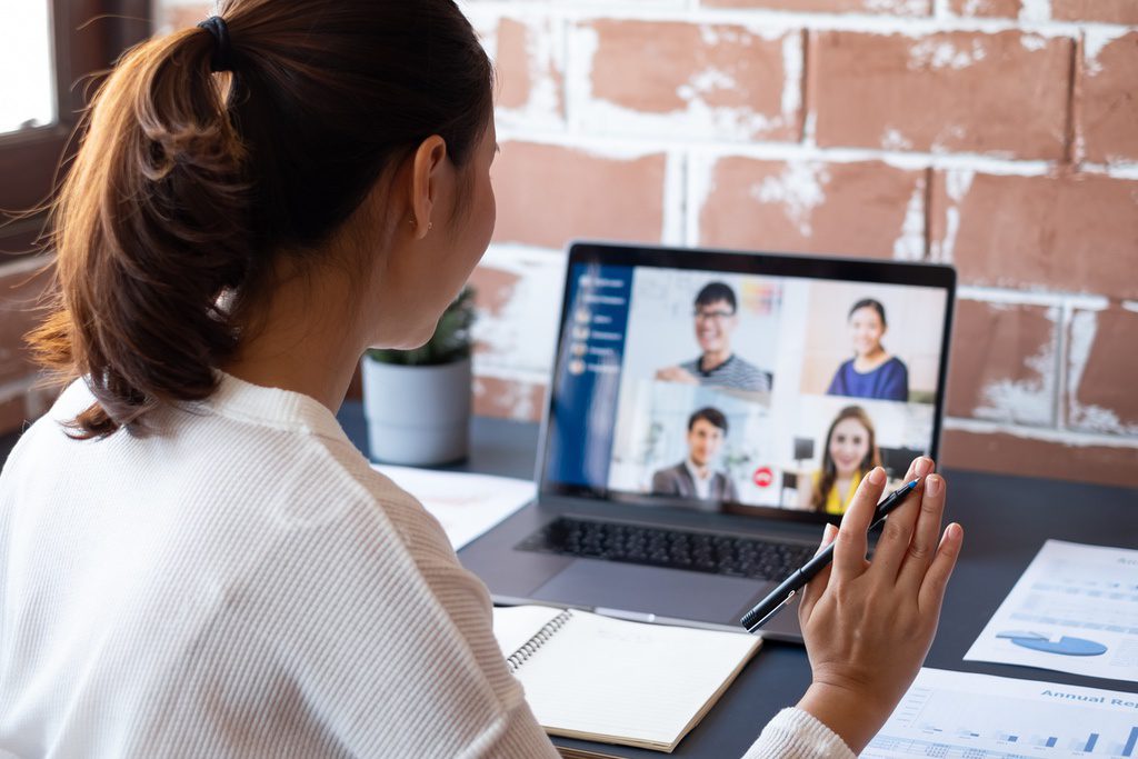 Remote worker collaborating remotely with team members