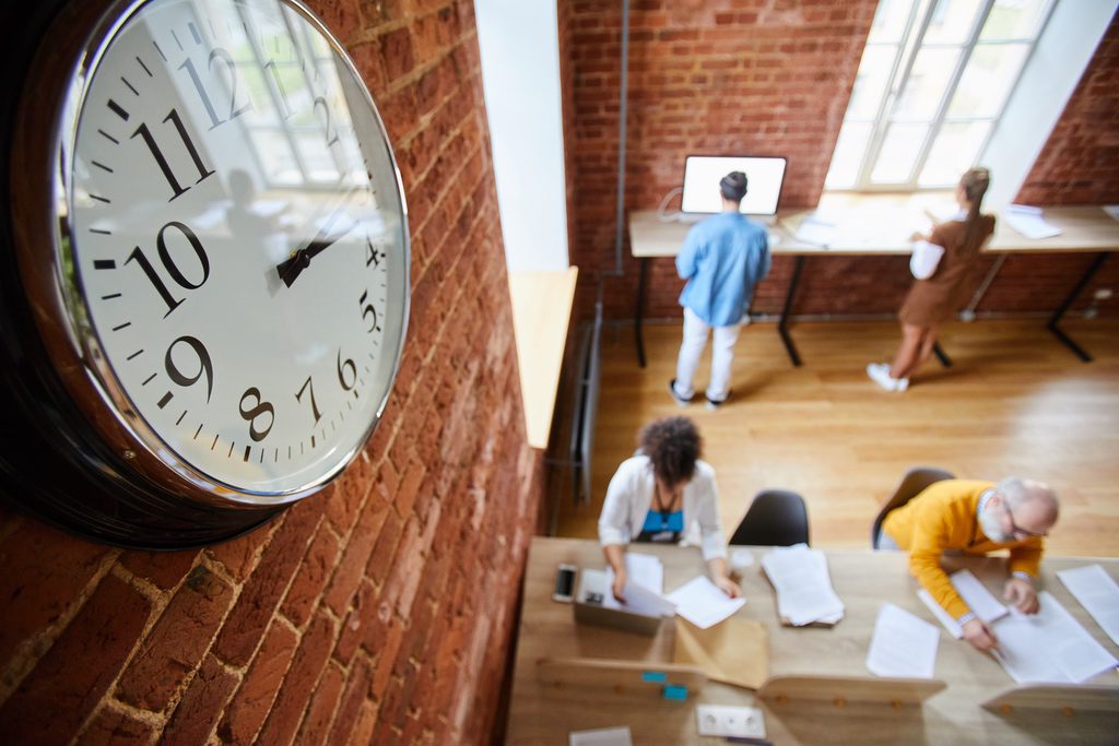 Clock on wall of office to demonstrate peak occupancy times