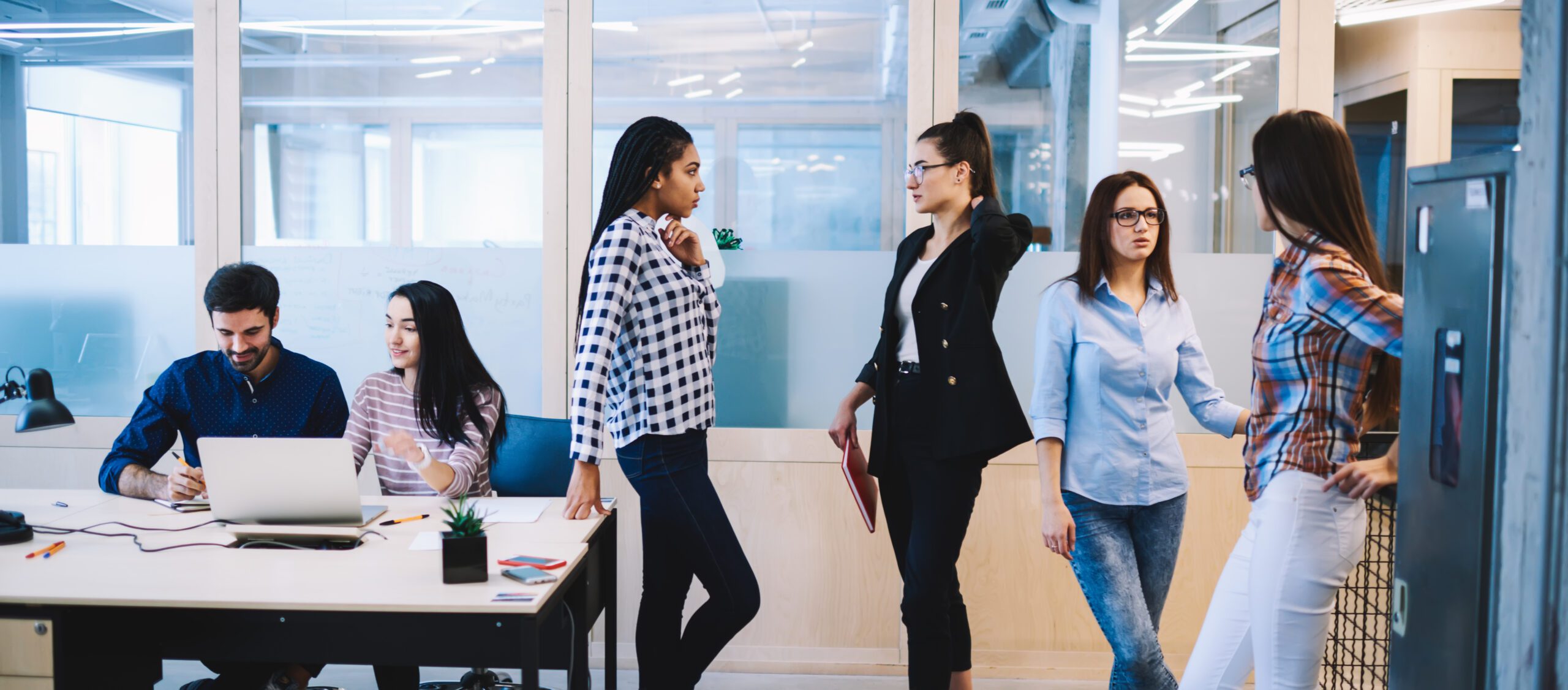 friendly colleagues collaborating in an open-plan office