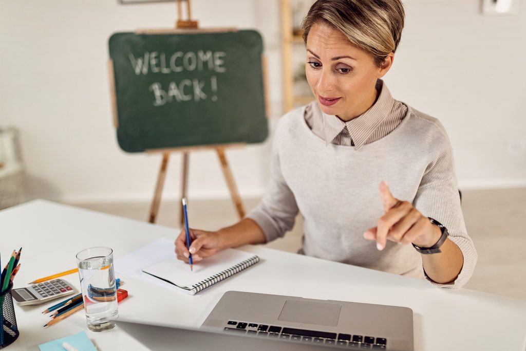 Teacher working from home and using LMS to organize educational content