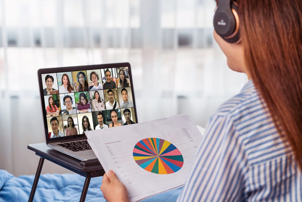 Adult student in virtual classroom learning from her bedroom